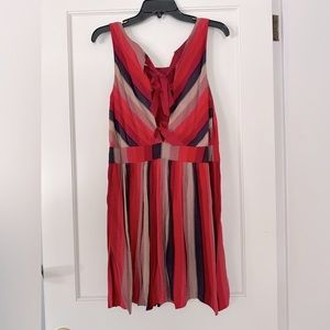 Bright colored open back dress with bows